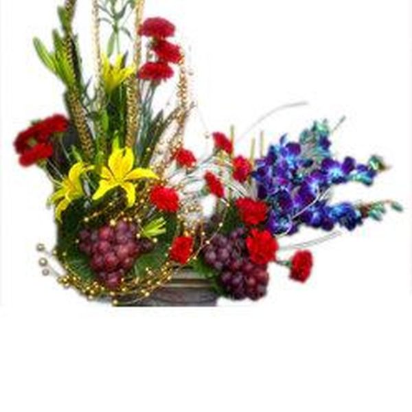 Floral arrangement with yellow lilies red carnation
